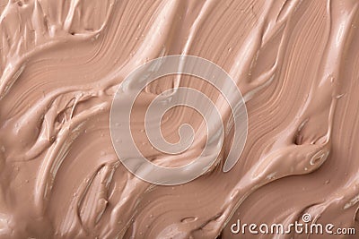 Beige liquid foundation makeup as a background. Top view. Flat lay pattern Stock Photo