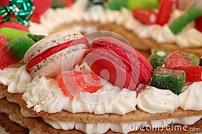 Beige and pink macaroon cookie and candies on a number cake Stock Photo