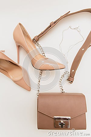 Beige shoes and bag on a light background Stock Photo