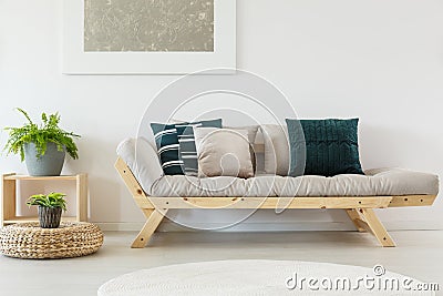 Beige sofa with blue pillows Stock Photo