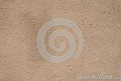 Beige textured wall, background. Structural plaster coated with water-based acrylic paint. Rough, uneven surface beige Stock Photo