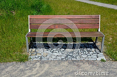 Beige threshing path gravel with delimited edges granite cubes in a row and dividing channels from the cube trough channel due to Stock Photo