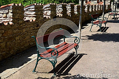 Beige threshing path gravel with delimited edges granite cubes in a row and dividing channels from the cube trough channel due to Stock Photo