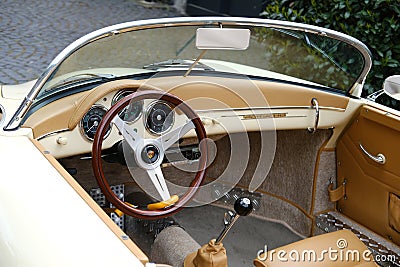 beige vintage porsche 356 Cabriolet cockpit, Retro luxury sports car which first produced by Austrian company Porsche, Oldtimer Editorial Stock Photo