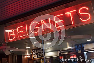 Beignets Neon Sign in New Orleans, Louisiana Bakery Editorial Stock Photo