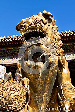 Bronze gilded lions gate guards driving away the devils. The Imperial Palace, Beijing Stock Photo