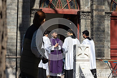 Chinese catholic priests at St. Michael Church in Beijing Editorial Stock Photo