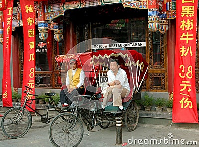 Beijing, China: Pedicab Drivers in Hutong Editorial Stock Photo