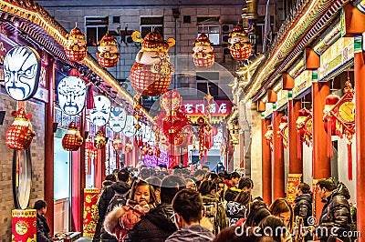 BEIJING China 23.02.2019 People crowd famous Wangfujing snack street during night in Peking Editorial Stock Photo