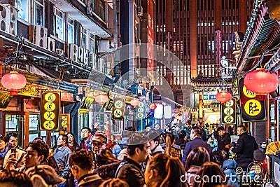 BEIJING China 23.02.2019 People crowd famous Wangfujing snack street during night in Peking Editorial Stock Photo