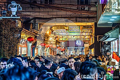 BEIJING China 23.02.2019 People crowd famous Wangfujing snack street during night in Peking Editorial Stock Photo