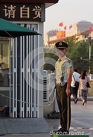 BEIJING - July 3: a soldier stands guard at Tiananmen square Editorial Stock Photo