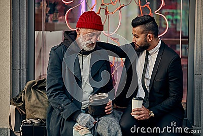 Being extremely kind to homeless people Stock Photo