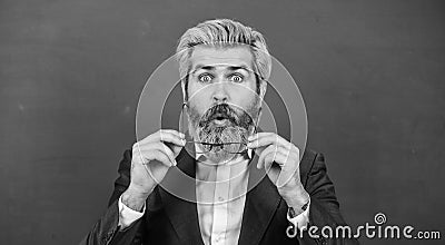 Being open to surprise in classroom. Surprised teacher green chalkboard. Bearded man look surprised. Surprised and Stock Photo
