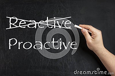 Being Proactive not Reactive crossed blackboard chalkboard Stock Photo