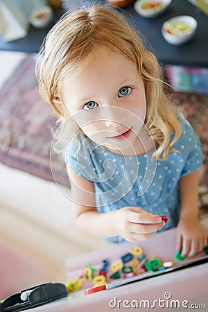 Being young is all about having fun. Portrait of an adorable little girl having fun at home. Stock Photo