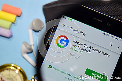 Google Go: A Lighter, faster way to search dev app with magnifying on Smartphone screen Editorial Stock Photo