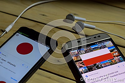 Japan Vs Poland on Smartphone screen Editorial Stock Photo