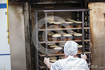 Woman baker at work Editorial Stock Photo