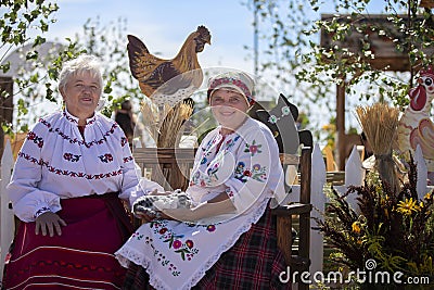 Elderly Slavic women in national dress. Editorial Stock Photo