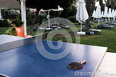 Belek, Turkey - October 2020: Nobody playing table tennis outside. Hotels surviving during quarantine. Racket on a blue table, Editorial Stock Photo