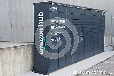 Amazon logo on grey hug locker machine in front of the train station Editorial Stock Photo