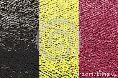 Belgian Flag on a Cobblestone Road Pattern Stock Photo