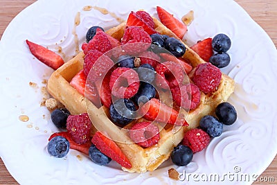 Belgian waffle with berries and syrup Stock Photo