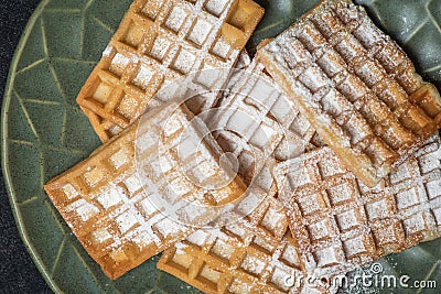 Belgian waffles sprinkled with powdered sugar Stock Photo