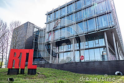 Belgium, Brussels, Facade of the RTL House with the RTL logo in red Editorial Stock Photo