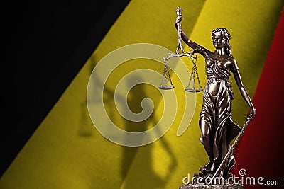 Belgium flag with statue of lady justice and judicial scales in dark room. Concept of judgement and punishment Stock Photo