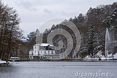 Belgium, Spa, View of Lake Warfaaz under the snow with its pedal boats Editorial Stock Photo