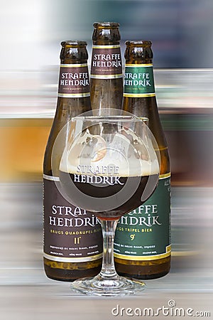 Belgium Straffe Hendrik beers bottles and glass isolated on blurred background Editorial Stock Photo