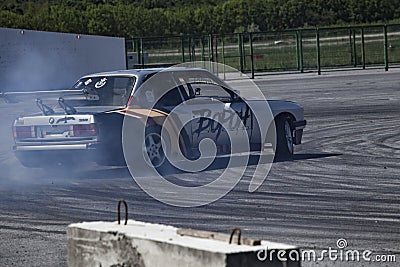 Belgorod , Russia - OCT 13, 2018: A drift racing car in action with smoking tires in track Editorial Stock Photo