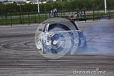 Belgorod , Russia - OCT 13, 2018: A drift racing car in action with smoking tires in track Editorial Stock Photo