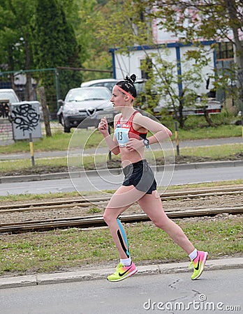 BELGRADE, SERBIA - APRIL 22: An unidentified woman runs in 30th Belgrade Marathon on April 22, 2017 Editorial Stock Photo