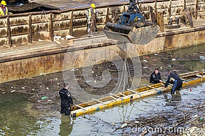 Divers working on river bank protection Editorial Stock Photo