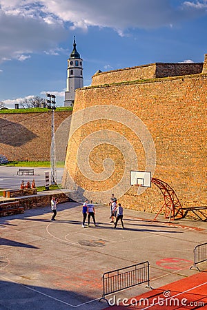 Teenagers playing basketball at basketball court in Belgrade fortress in Serbia Editorial Stock Photo
