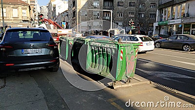 Belgrade, Serbia. January 24, 2020. Garbage containers in the city center. Roadway with cars. Asphalt road with passers-by Editorial Stock Photo