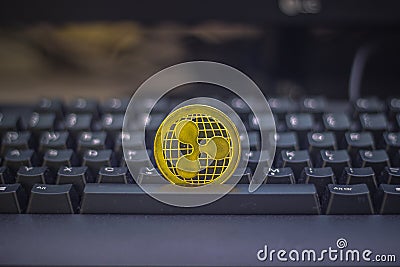 One gold Ripple Coin on keyboard Editorial Stock Photo