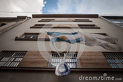 Sign indicating the Argentinian embassy of Belgrade with flags of Argentina and mercosur. Editorial Stock Photo