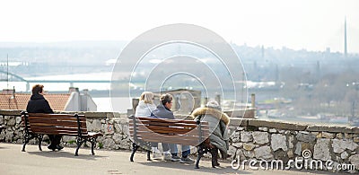 Belgrade, Serbia - March 7, 2023: People are relaxing on benches on observation deck of Kalemegdan Park located nearby Belgrade Editorial Stock Photo