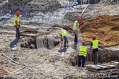 Construction workers setting steel Editorial Stock Photo