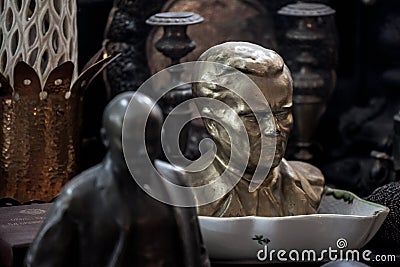 Bust of Marshal Josip broz Tito facing a small statue of Vladimir Lenin. Editorial Stock Photo