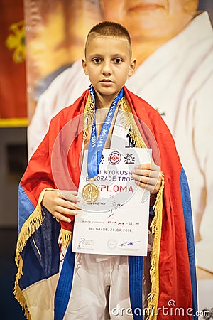 Kids and children winners receive cups and medals on podium Editorial Stock Photo