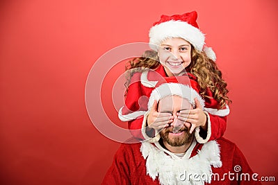 Belief in santa constitutes most magical part of childhood. Guess who. Surprise concept. Girl child and bearded father Stock Photo