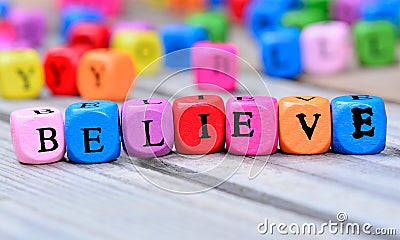 Believe word on table Stock Photo