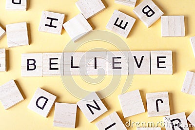 BELIEVE word written on wood block. Wooden ABC Stock Photo