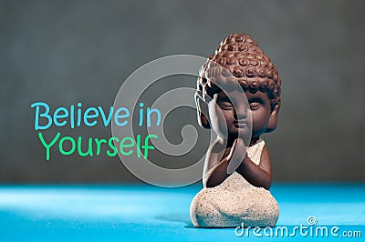 Believe In Yourself Confident Encourage Motivation Concept with meditating or praying baby buddha Stock Photo