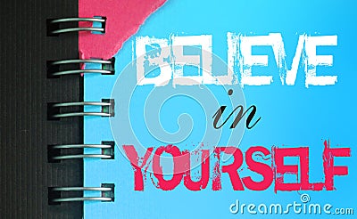 Believe in Yourself text message words on sky blue page of copyybok in white and pink. Startup Motivational Business Inspirational Stock Photo